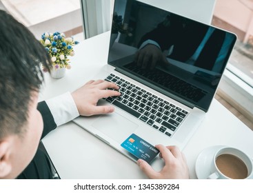 
Businessmen use the internet and online technology to make credit card transactions. - Shutterstock ID 1345389284