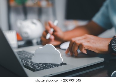 Businessmen use laptops to secure computing through cloud storage for digital business and cloud data processing management. Optimizing online business customer service
