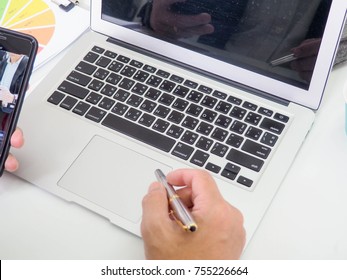 businessmen using laptop analyzing marketing strategy with statistic graph and notebook on the table. - Shutterstock ID 755226664