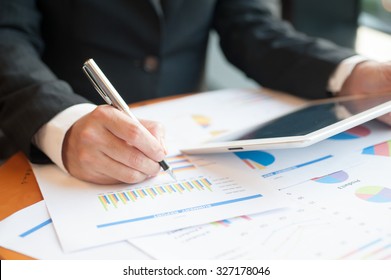 businessmen using tablet and writing business plan for meeting preparation in office.