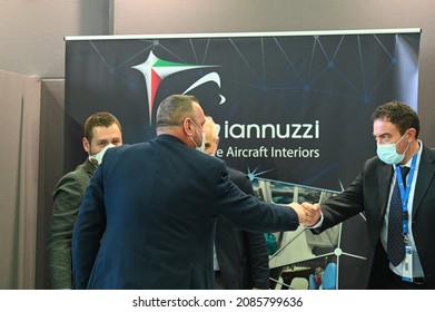 Businessmen At Work On Desk Wearing Protective Mask At International Fair Turin Italy December 2 2021