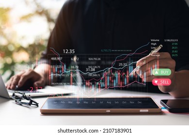 Businessmen work with stock market investments using tablets to analyze trading data. smartphone with stock exchange graph on screen. Financial stock market.