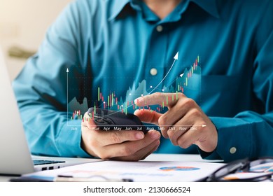 Businessmen work with stock market investments using tablets to analyze trading data. smartphone with stock exchange graph on screen. Financial stock market. - Shutterstock ID 2130666524