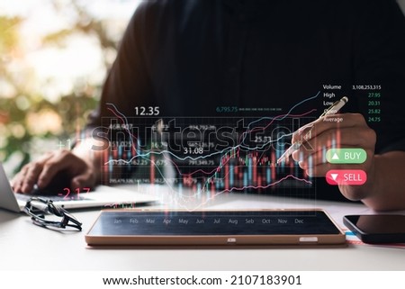 Businessmen work with stock market investments using tablets to analyze trading data. smartphone with stock exchange graph on screen. Financial stock market.