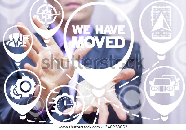 Businessmen working on a virtual screen of the
future and sees the inscription: WE HAVE MOVED. We have moved
business transport
concept.