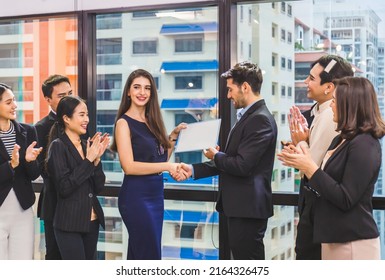 Businesspeople with certificate in the office, Employee gets a certificate of achievement, Businessman giving appreciation certificate to employee for achievement - Powered by Shutterstock