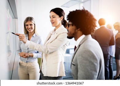 Businesspeople discussing together in conference room during meeting at office - Shutterstock ID 1364941067