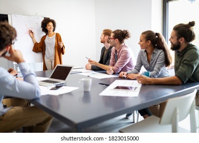 Businesspeople Discussing Together Conference Room During Stock Photo ...