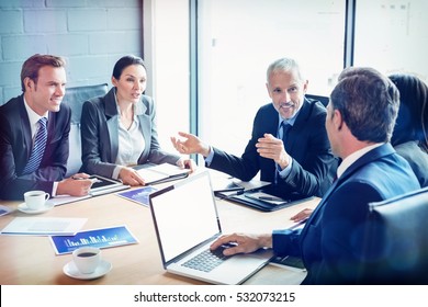 Businesspeople discussing together in conference room during meeting at office - Shutterstock ID 532073215