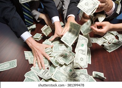 Businesspeople grabbing money