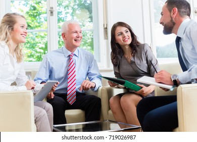 Businesspeople as group having discussion in office - Shutterstock ID 719026987