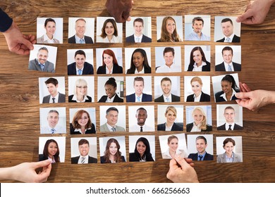 Businesspeople Hand Selecting The Candidate Portrait Photo For Hiring In Job