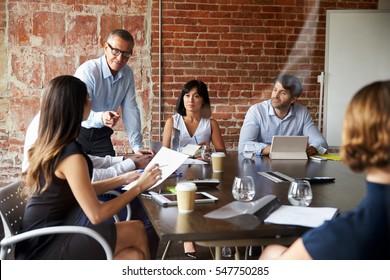 Businesspeople Meeting In Modern Boardroom Through Glass - Shutterstock ID 547750285