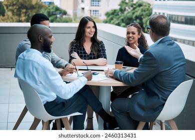 Businesspeople, meeting and outside with smile at table on rooftop for brainstorming or collaboration. Teamwork, about us and planning for career with conversation with colleagues in town in London. - Powered by Shutterstock