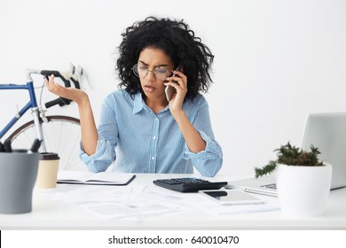 Businesspeople, Modern Technology And Communication. Upset Mixed Race Businesswoman Having Stressful Phone Conversation, Calling Customer Service About Budget Or Invoice Problem, Gesturing Actively