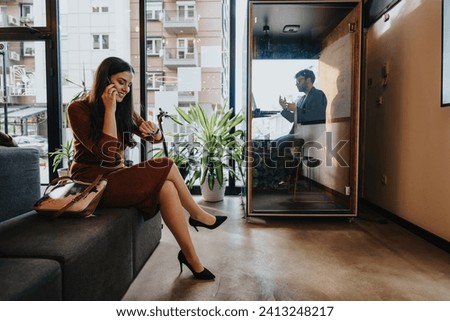 Businesspeople negotiating deals and discussing projects in an office. Employees working in office and phone booth, having phone calls and online meetings with clients.