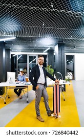 Businesspeople In The Office At Night Working Late.