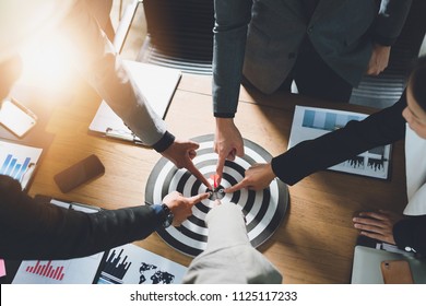Businesspeople Point to a darts aiming at the target center business,Targeting the business concept. - Shutterstock ID 1125117233