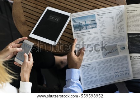 Businesspeople Reading Newspaper Using Mobile Techie