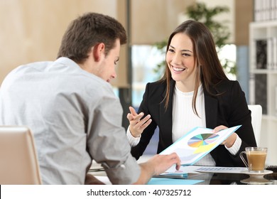 Businesspeople Smiling Coworking Commenting And Showing Growth Graphic And Taking A Business Conversation In An Office Interior