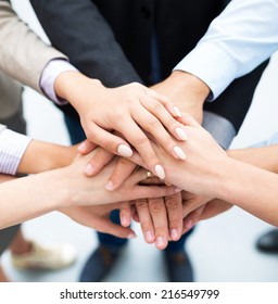 Businesspeople Stacking Hands