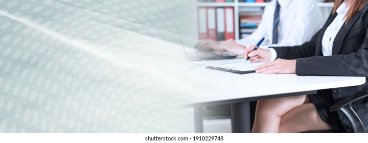 Businesspeople Taking Notes During Training; Panoramic Banner