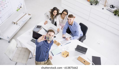 Businesspeople Taking A Selfie In The Office.