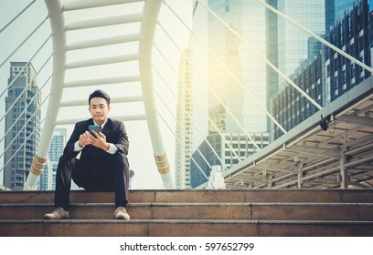 Businesspeople use cell phones to sit on a desk in the city. Contemporary communication concepts in the workplace.