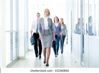 Businesspeople Walking In The Corridor Of An Business Center, Pronounced Motion Blur