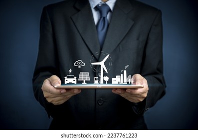 Businessperson holding tablet with virtual for working technology and business Net zero and carbon neutral concept. Renewable energy green businesses can limit climate change and global warming. - Powered by Shutterstock