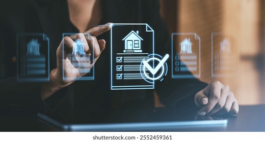 Businessperson interacting with a futuristic digital real estate interface, touching icons, with a transparent screen. Concept of real estate tech innovation - Powered by Shutterstock