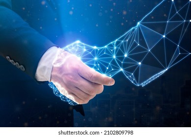 Businessperson shaking hand with digital partner over futuristic background. Artificial intelligence and machine learning process for 4th industrial revolution. - Shutterstock ID 2102809798