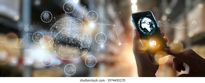 Businesss Workers using smartphone cargo and tracking delivery for Transportation and global network of smart logistics in blur warehouse background.