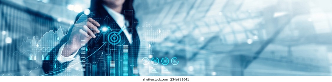 Businesswoman analyzing and calculating data for long term investment growth goals and company finance balance, Business strategy and plan for target. Economic analysis of Digital marketing. - Shutterstock ID 2346981641