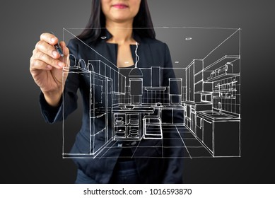 Businesswoman (Architect / Interior Designer) Drawing 3D Kitchen On Modern Futuristic Virtual Screen