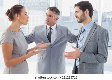 Businesswoman arguing with co-worker in office - Powered by Shutterstock