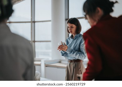 A businesswoman attentively examines a product sample during a team meeting in a modern office. The image captures a multicultural team collaborating. Ideal for concepts of focus, teamwork, and - Powered by Shutterstock