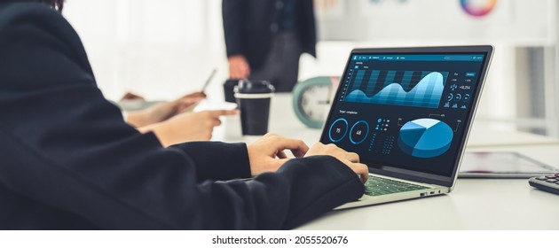 Businesswoman in business meeting using laptop computer proficiently at office for marketing data analysis . Corporate business team collaboration concept . - Shutterstock ID 2055520676