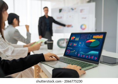 Businesswoman in business meeting using laptop computer proficiently at office for marketing data analysis . Corporate business team collaboration concept . - Shutterstock ID 2066775230