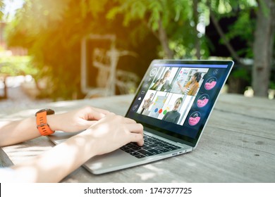 Businesswoman And Business Team In Video Conference For Protection Covid-19.woman Watching Laptop Webinar Video Course In Garden At Home.Webinar,social Distancing,e Learning And Seminar Online Concept