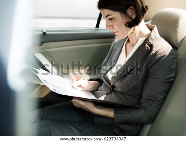 Businesswoman Busy Working Car\
Inside