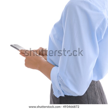 Businesswoman with cellphone on light background