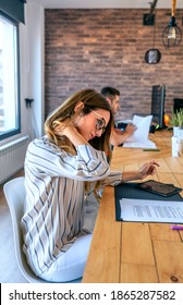 Businesswoman With Cervical Pain Massaging Her Neck