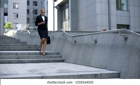 Businesswoman Checking Mail On Smartphone, Walking Down Stairs, Workaholic