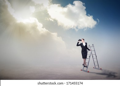 businesswoman climbed a ladder and looking through binoculars