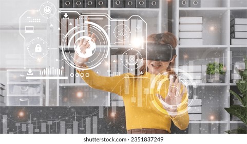 Businesswoman in comfortable clothes using Virtual Reality simulator headset and developing a new project. Concept of virtual reality and successful business - Powered by Shutterstock