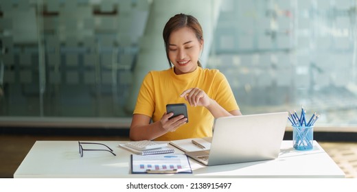 A businesswoman completes KYC using an online banking program in order to open a digital savings account. The definition of cyber security. - Shutterstock ID 2138915497
