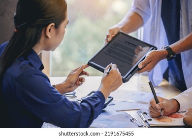 Businesswoman with digital pencil to puts signature on digital electronic contract in digital tablet. Smart Business investment concept. Selected focus - Shutterstock ID 2191675455