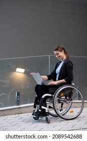 Businesswoman with a disability who uses a wheelchair working outside
