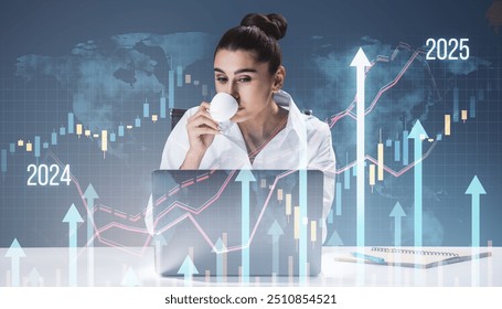 Businesswoman drinking coffee at desk with laptop, financial charts and upward arrows overlay on digital background. Concept of growth - Powered by Shutterstock